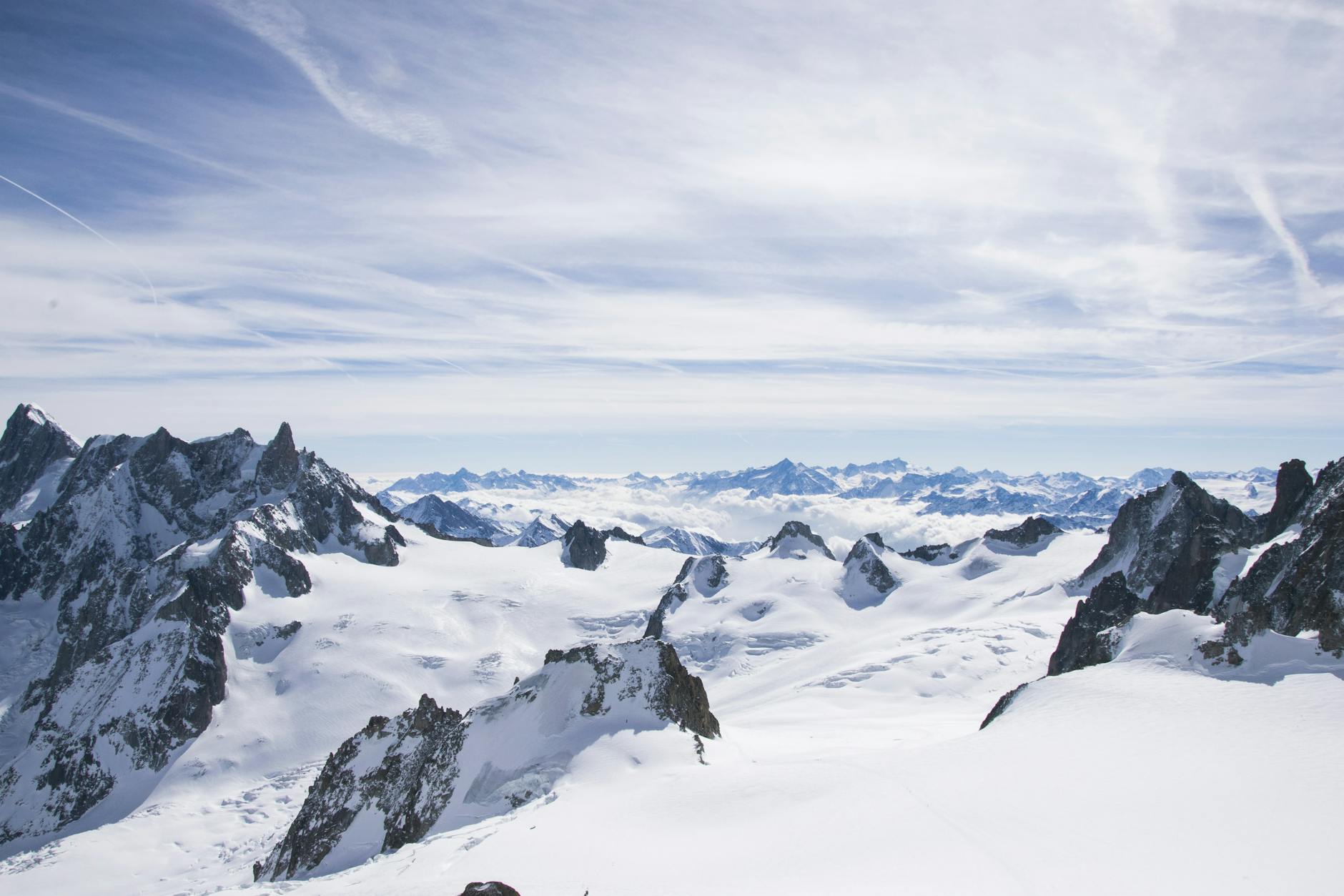 Breathtaking view of Mont Blanc showcasing its icy, rugged peaks under a blue sky