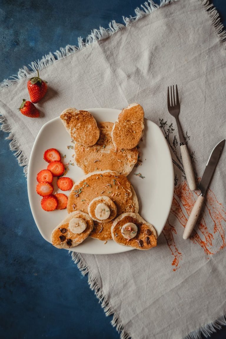 Fun and delicious bunny-shaped pancakes with strawberries and bananas. Perfect for kids' breakfast.