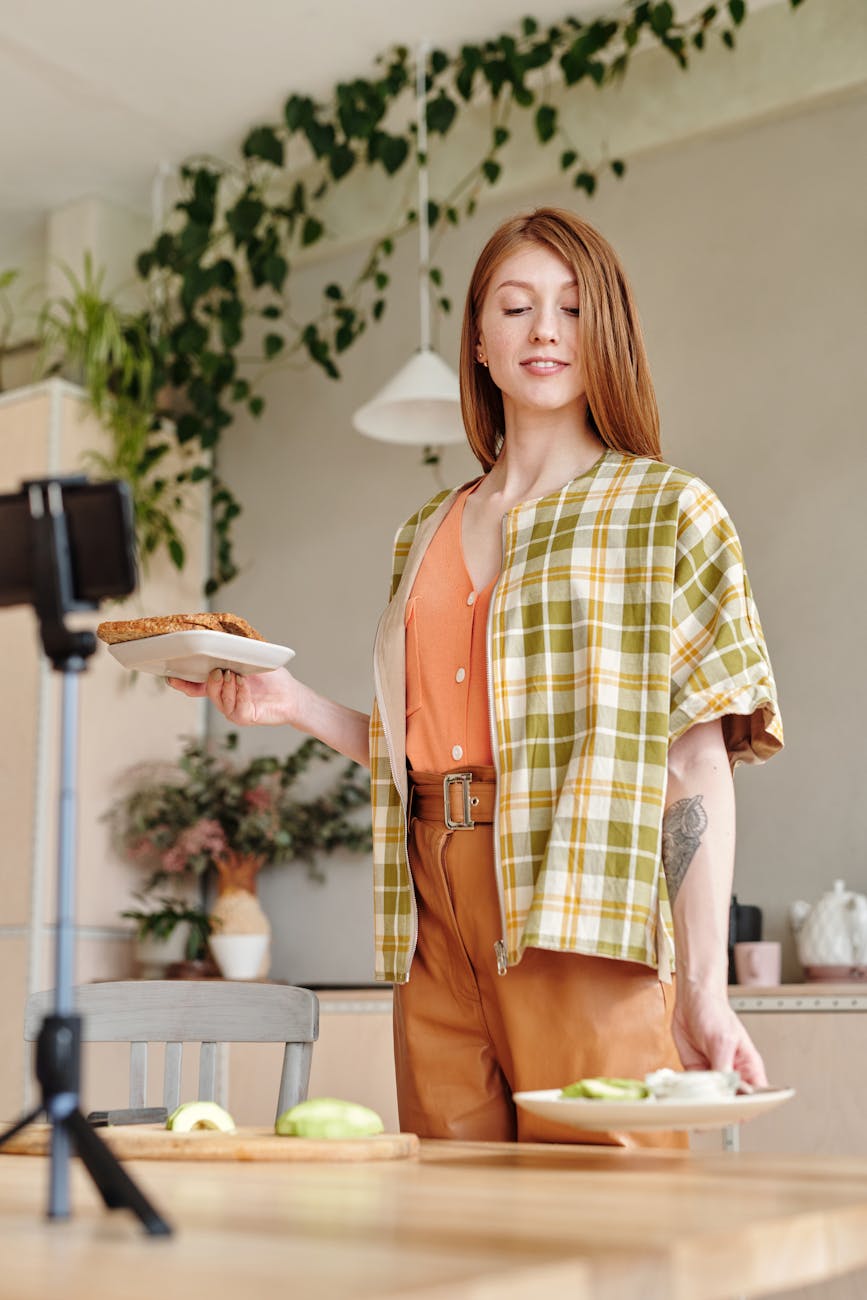 Woman cooking avocado toast in a stylish kitchen, perfect for lifestyle and culinary themes.