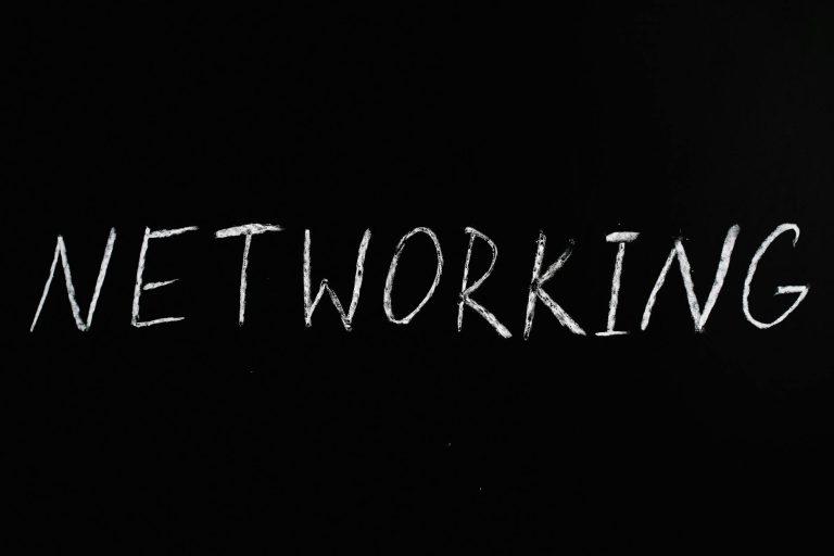 Handwritten 'Networking' text on a chalkboard styled black background, symbolizing communication.