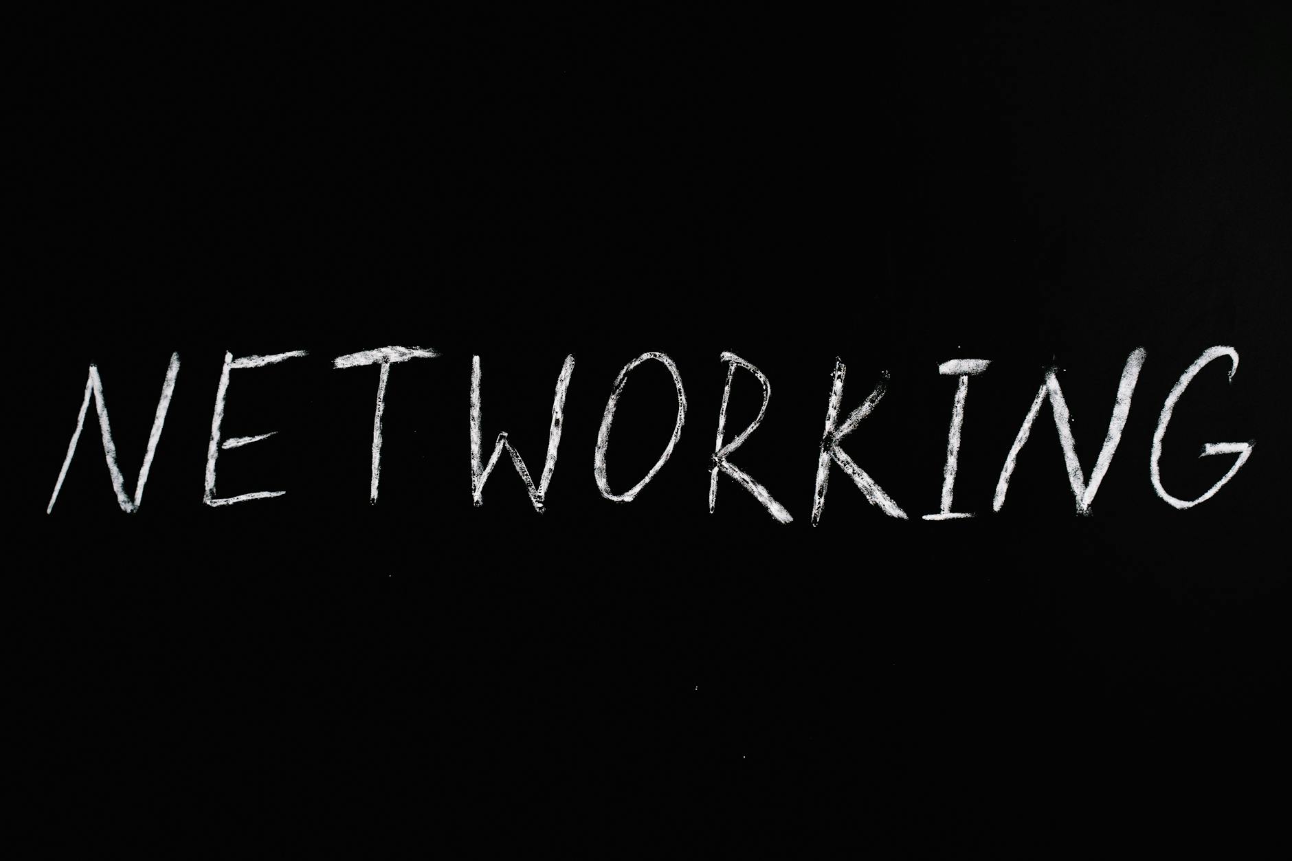 Handwritten 'Networking' text on a chalkboard styled black background, symbolizing communication.