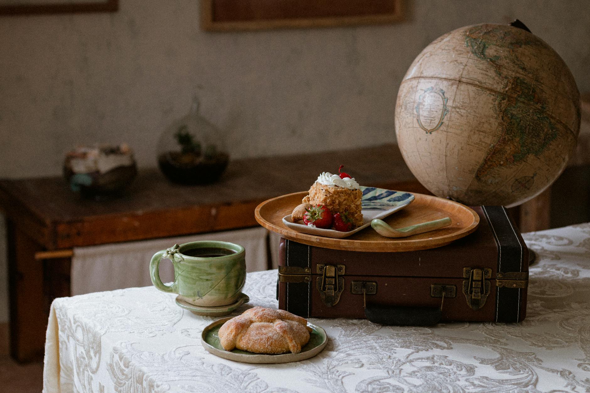 A rustic Chiapas breakfast setting with artisanal ceramics and globe.