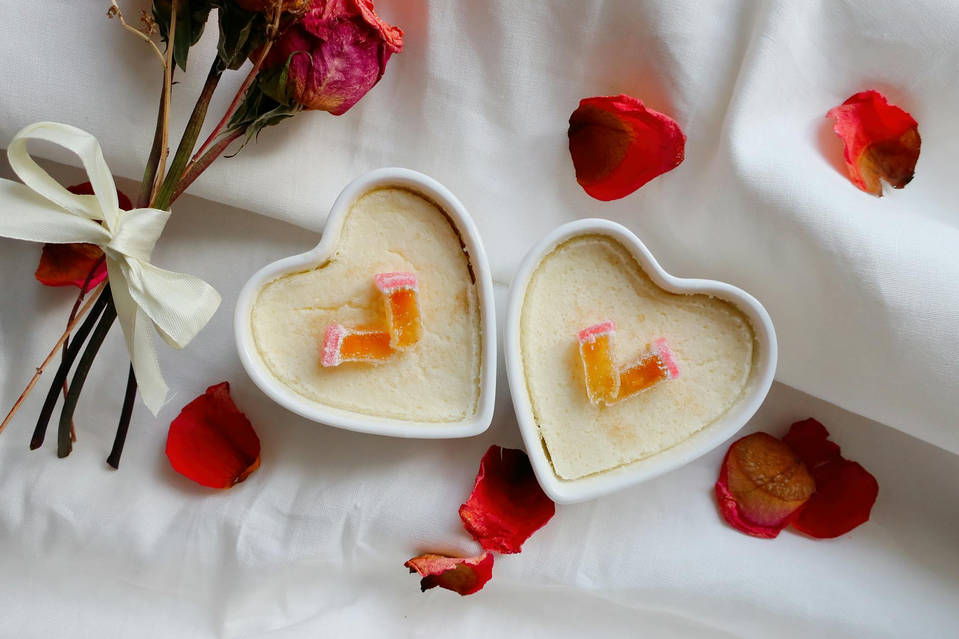 Delightful heart-shaped desserts with roses and petals, perfect for Valentine's Day.