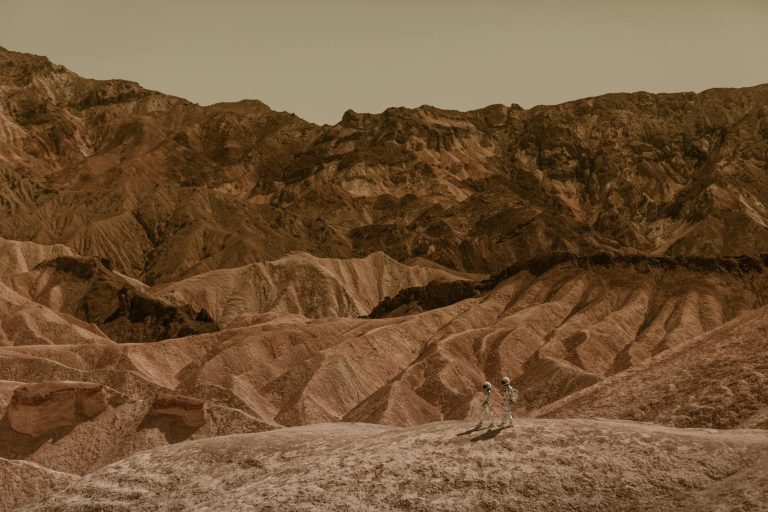 Astronauts exploring a stunning desert landscape, resembling Mars.