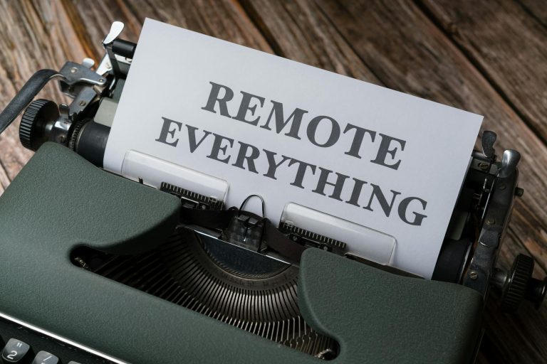 Old-fashioned typewriter with a paper showing the words 'Remote Everything', symbolizing remote work and virtual connectivity.